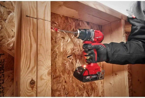 Compact 2-Tool Combo Kit with Brushless Impact Driver and Wrench Boss Gear for Demanding Jobs Epic Shop Essential M18 Cordless System in action drilling into wood.