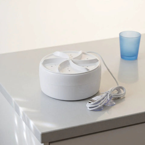 Portable Ultrasonic Washing Machine For Delicates And Underwear A Compact Space Saver For Dorms And Rvs on countertop.