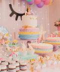 Top Shelf 114 Piece Cake Decorating Kit Loaded With Fondant Plunger Cutters Sugar Craft Molds Rolling Pin Scraper And Pro Level Icing Tools For Killer Diy Baking displayed with colorful unicorn cakes and desserts.