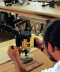 Pro Grade Workhorse Two Horsepower Plunge Router With Slick Ten Amp Electronic Variable Speed Motor in use on woodworking project.