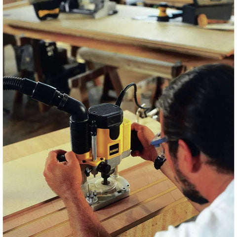 Pro Grade Workhorse Two Horsepower Plunge Router With Slick Ten Amp Electronic Variable Speed Motor in use on woodworking project.