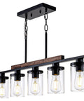 Modern Farmhouse 5 Light Linear Chandelier for Kitchen Island and Dining Room with Adjustable Rustic Pendant Light Black Metal Frame Real Wood Accent Clear Glass Shades Industrial Style Vibe, showing all five clear glass shades.