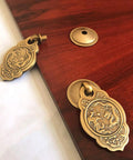 Chinese Style Vintage Brass Drawer Pulls Set Of 2 With Antique Bronze Finish, shown on wood surface