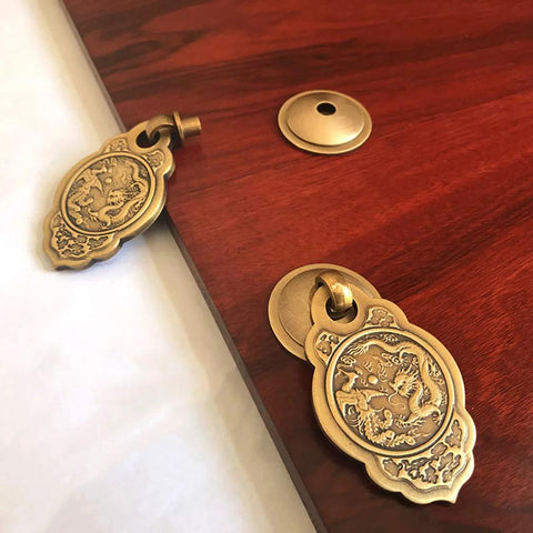 Chinese Style Vintage Brass Drawer Pulls Set Of 2 With Antique Bronze Finish, shown on wood surface