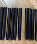 Ten Pack Magnesium Fire Starter Rods For Camping And Survival No Fuss Ferrocerium Flint Lighters 80mm By 8mm Glow In The Dark Spark Kit Compact Outdoor Tool With Lanyard Hole displayed on wood surface.