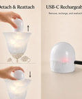Folux Battery-Operated Vintage White Flower Wall Sconce Set of 2, showcasing the USB-C rechargeable bulb detaching and reattaching.