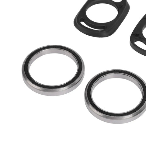 Close-up of two metal bearings from Complete Mountain Bike Headset Kit With CNC Machined Spacers, Top And Bottom Covers, Bearings, Fork Expander Plug