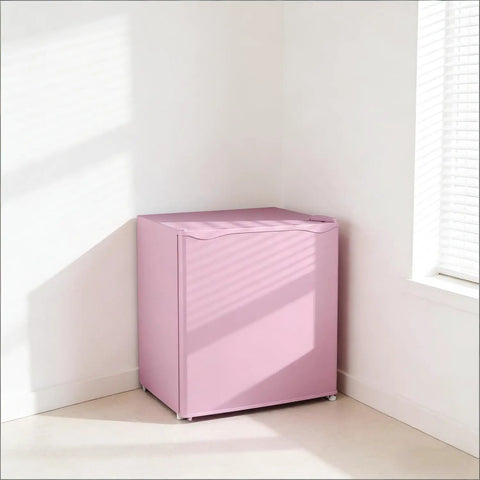 Slick Compact Upright Freezer Featuring Adjustable Temperature Settings Removable Shelf Reversible Door For Tight Kitchens in pink color.