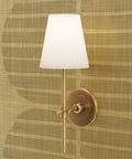 Stylish wall sconce light fixture on High End Geometric Stripe Gold Metallic Wallpaper For Walls for modern decor.