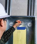 Worker using Skribes Fine Tip Permanent Marker 12 Pack For Worksite And Multi Surface Use Black Ink That Writes On Wet Dry And Oily Surfaces