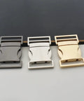 Three 25mm metal side release buckles in black, silver, and light gold. Built Tough 25mm Side Release Buckle Set 5 Pack Metal Quick Release Buckles For Paracord Bracelets Dog Collars Harnesses Backpacks Webbing And Leather DIY Projects Light Gold Finish visible on display surface.