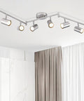 Dope 6 Light Brushed Nickel Ceiling Track Lighting Fixture Kit With Adjustable GU10 Heads in a modern room setting