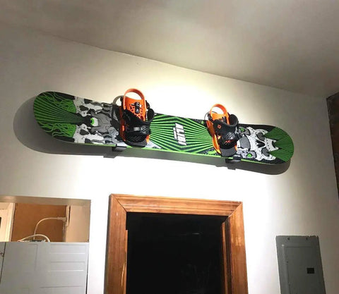 Heavy Duty Snowboard Wall Mount Rack For Garage Organization And Wall Storage, displaying snowboard with orange bindings