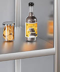 Tough As Nails Heavy Duty Stainless Steel Shelving Rack Featuring Rustproof Construction And Slick Metal Storage Organizer For Commercial Kitchen Warehouse Or Garage Setup with a glass and bottle on a shelf.