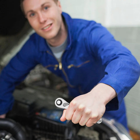 Quarter Inch Ratchet Socket Wrench With Quick Grip For Easy Bolt Fastening And Smooth Auto Repair Work being held by a mechanic.