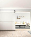 Black Straight Design Sliding Barn Door Hardware Kit for Single Wood Door installed in living room, track system visible.