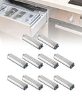 10 Pack Magnetic Push Open Latches For Cabinets And Drawers in stainless steel, displayed in front of an open kitchen drawer.