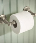Toilet paper holder from Sage Collection 3 Piece Decorative Bath Hardware Set in brushed nickel, wall mounted in bathroom.