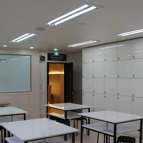 Brightly lit room with 2Ft LED T8 Tube Ballast Bypass Daylight 5000K Dual End Lighting fixtures on the ceiling.