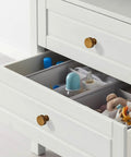 Antique Brass Cabinet Knobs For Dresser Drawers 10 Pack Zinc Hardware Durable Finish Easy Install Ideal For Kitchen Cabinets Living Rooms Dressers And Chests With A Killer Classic Vibe By Asidrama installed on a white drawer with storage items.