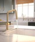 hansgrohe Talis N Pull Down Kitchen Faucet, Modern, Magnetic Hand Sprayer, 1-Handle, 1.75 GPM, Brushed Bronze, water flowing into a sink.