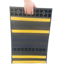 Person holding Self Adhesive Anti Skid Rubber Car Parking Guide Mat 2 Pack with Reflective Strips, 23.6 x 15.7 x 2.8 inches, durable garage wheel stopper.