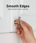 Hand installing two tone brushed nickel and gold cabinet knob on white cupboard door, smooth edges visible.