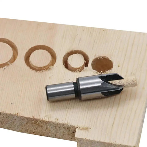 Kickass Eight Piece Wood Plug Cutter Drill Bit Set Offering Straight And Tapered Options For Heavy Duty DIY Projects And Home Renovations Real Deal Steel Bits That Slice Clean Every Single Time. Close-up of a steel plug cutter on wood.