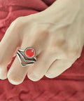 Red Agate Stone V Shape Chevron Ring In Retro Stainless Steel 8mm Wide on hand, showcasing natural quartz crystal gem setting.