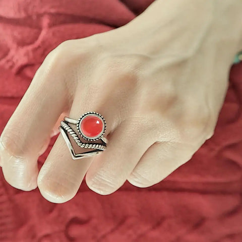 Red Agate Stone V Shape Chevron Ring In Retro Stainless Steel 8mm Wide on hand, showcasing natural quartz crystal gem setting.