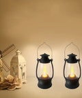5.1 Inch Mini Lanterns Six Pack LED Candle Lanterns with flickering warm flame next to decorative ornaments on a shelf