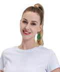 Totally Fire Green Grid Teardrop Faux Leather Dangle Earrings With Silver Plated Hooks worn by a woman in a white shirt.