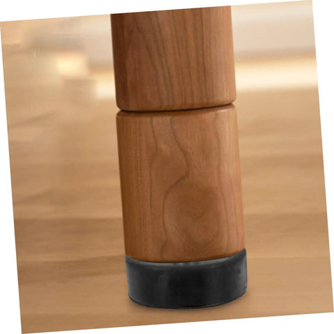 Close-up of table leg with 4 Pack Adjustable Rubber Shock Absorber Feet Pads For Noise Reduction And Vibration Control On Cabinets Tables And Appliances Heavy Duty Anti Vibration Pads For Washers Machines And Air Compressors