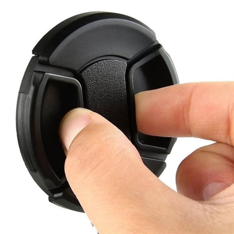 Close-up of hand using 5 Pack 58mm Lens Cap Bundle Front Filter Snap On Pinch Cap Protector Cover For DSLR And SLR Camera Lenses