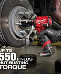 M12 FUEL Stubby Half Inch Impact Wrench With 550 Ft Lbs Torque in use on automotive wheel, showing POWERSTATE Brushless Motor.