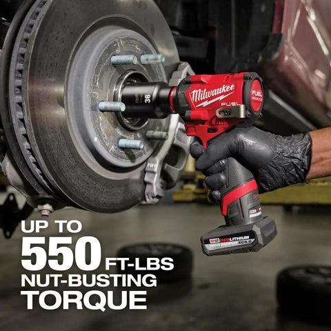 M12 FUEL Stubby Half Inch Impact Wrench With 550 Ft Lbs Torque in use on automotive wheel, showing POWERSTATE Brushless Motor.