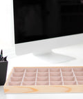 Straight Up Premium Pine Wood Jewelry Tray With 24 Compartments And Plush Velvet Lining To Store Your Bling on a desk beside a computer.