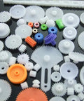 78 Piece Plastic Gear Kit For Motors And Robots with assorted gears, axles, and tires for DIY projects