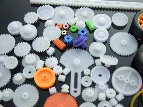 78 Piece Plastic Gear Kit For Motors And Robots with assorted gears, axles, and tires for DIY projects