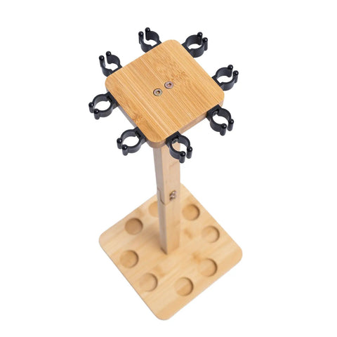Top view of Eight Rod Floor Stand For Fishing Poles Bamboo Base Storage Rack With Soft Ring Protectors, square and stable design.