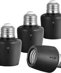 Four black Dusk To Dawn Outdoor Light Socket E26 E27 Adapter With No Fuss Auto Photocell Sensor for porch and post lamps.
