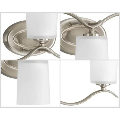 Close-up of Three Light Brushed Nickel Bath Vanity Light With Etched Glass Shades for Traditional Bathroom Style Classic Fixture