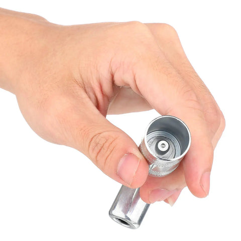 Hand holding 90 Degree Grease Coupler And Gun Adapter Two Pack With 3 Jaw Swivel Right Fittings For No Spill Greasing Quick Lock And Release