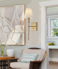 Living room with Gold Linen Wall Sconce Dimmable On Off Dimmer Modern Bathroom Vanity Light beside abstract art and wicker chair.