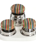 Kick Start Your Morning Routine With This Espresso Tamper Set Featuring A Self Leveling Distributor And Calibrated Tool For 58mm Portafilters, Plus A Nifty Silicone Mat And Magnetic Base For Fresh Brews. Colorful tamper handles on shiny stainless steel bases.