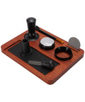 Solid Wood Espresso Tamper Station With Silicone Mat And Seven Piece Barista Gear featuring black tools on a hardwood base.