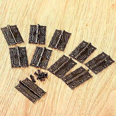 Antique Bronze Iron Hinge Set 36x23mm 10 Pieces Vintage Flower Pattern Decorative Hardware on wooden surface