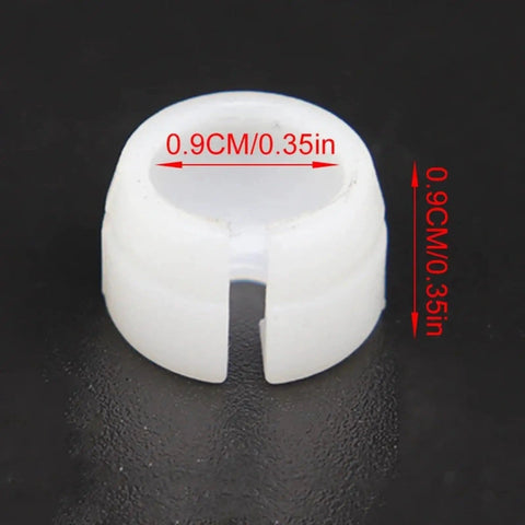 Close-up of white bushing end clip from Land Rover Range Rover Evoque Shift Cable Replacement Kit for 2011-2019 Manual Transmission