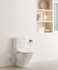 Next Level Bidet Toilet Seat Featuring Dual Warm Water Spray Plus Quick Air Dry Fan installed in a modern bathroom.