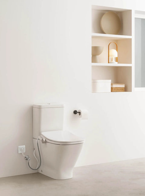 Next Level Bidet Toilet Seat Featuring Dual Warm Water Spray Plus Quick Air Dry Fan installed in a modern bathroom.